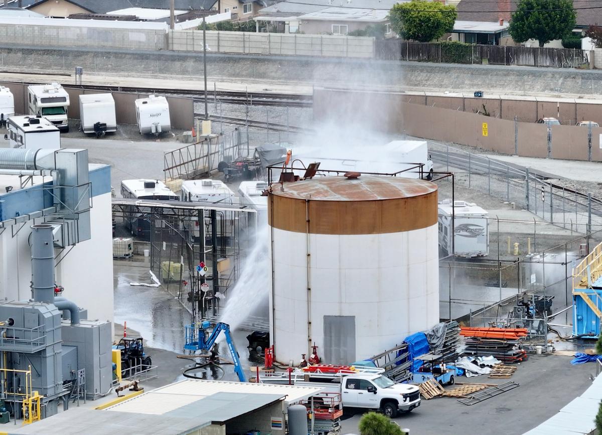  Water is sprayed on a tank that overheated at an aerospace plant in Garden Grove, California, on May 22. 