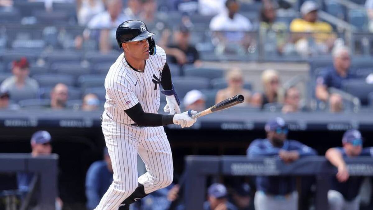 New York Yankees catcher Carlos Narvaez (94) follows through on a single against the Tampa Bay Rays in his first MLB at bat during the ninth inning at Yankee Stadium. | Brad Penner-Imagn Images 