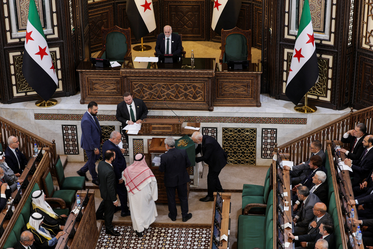 Members of Syria's newly formed People's Assembly attend the body's inaugural session, the first parliament session since the end of the rule of ousted Syrian President Bashar al-Assad, in Damascus, Syria, July 12, 2026. REUTERS/Khalil Ashawi