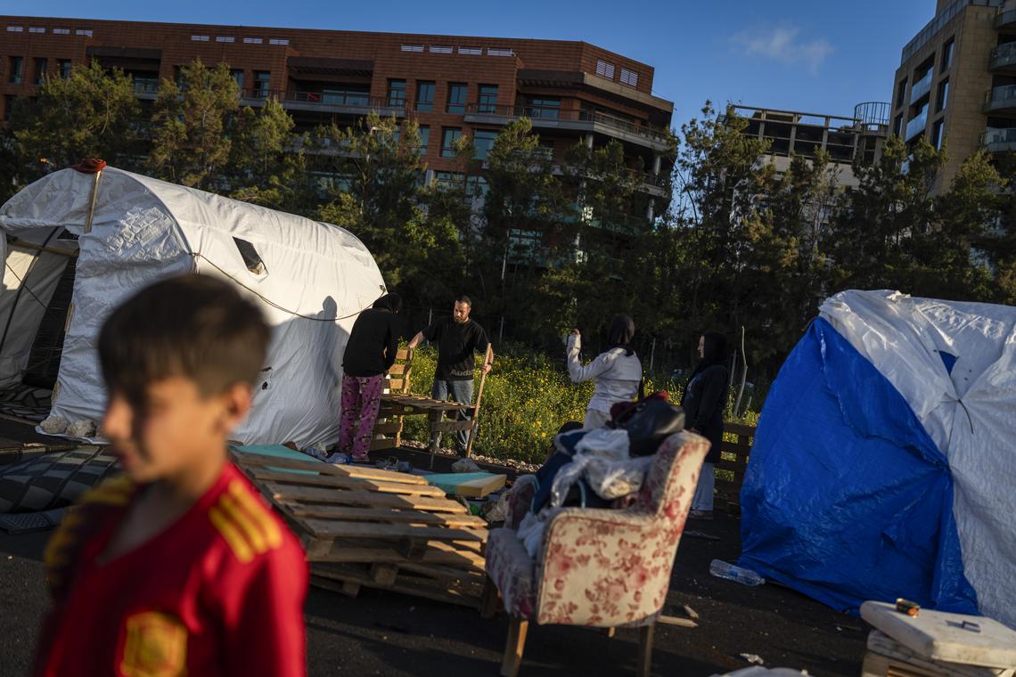 A group of internally displaced people expand their shelter in Beirut, Lebanon, on Monday, April 20, 2026. The Lebanese president said he had appointed a former ambassador to the United States to lead talks aimed at ending war with Israel and achieving a complete Israeli withdrawal from southern Lebanon. (Diego Ibarra Sánchez/The New York Times)