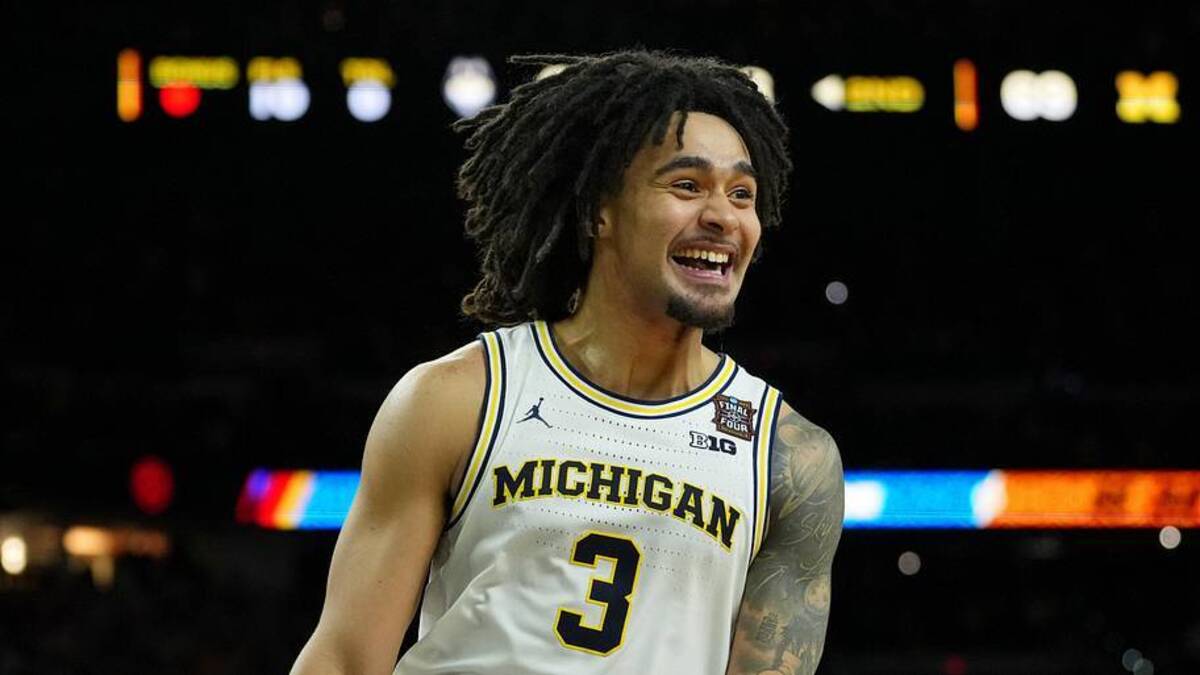  Apr 6, 2026; Indianapolis, IN, USA; Michigan Wolverines guard Elliot Cadeau (3) celebrates after their win against the UConn Huskies in the national championship of the Final Four of the men's 2026 NCAA Tournament between the and the Michigan Wolverines at Lucas Oil Stadium. Mandatory Credit: Bob Donnan-Imagn Images | Bob Donnan-Imagn Images 