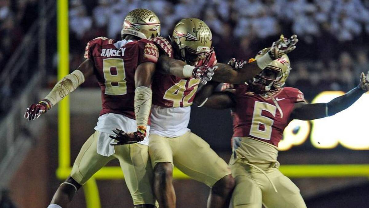  Nov 29, 2014; Tallahassee, FL, USA; Florida State Seminoles defensive back Jalen Ramsey (8), defensive back Lamarcus Brutus (42), and cornerback Nick Waisome (6) celebrate during the game against the Florida Gators at Doak Campbell Stadium. Mandatory Credit: Melina Vastola-Imagn Images | Melina Vastola-Imagn Images 