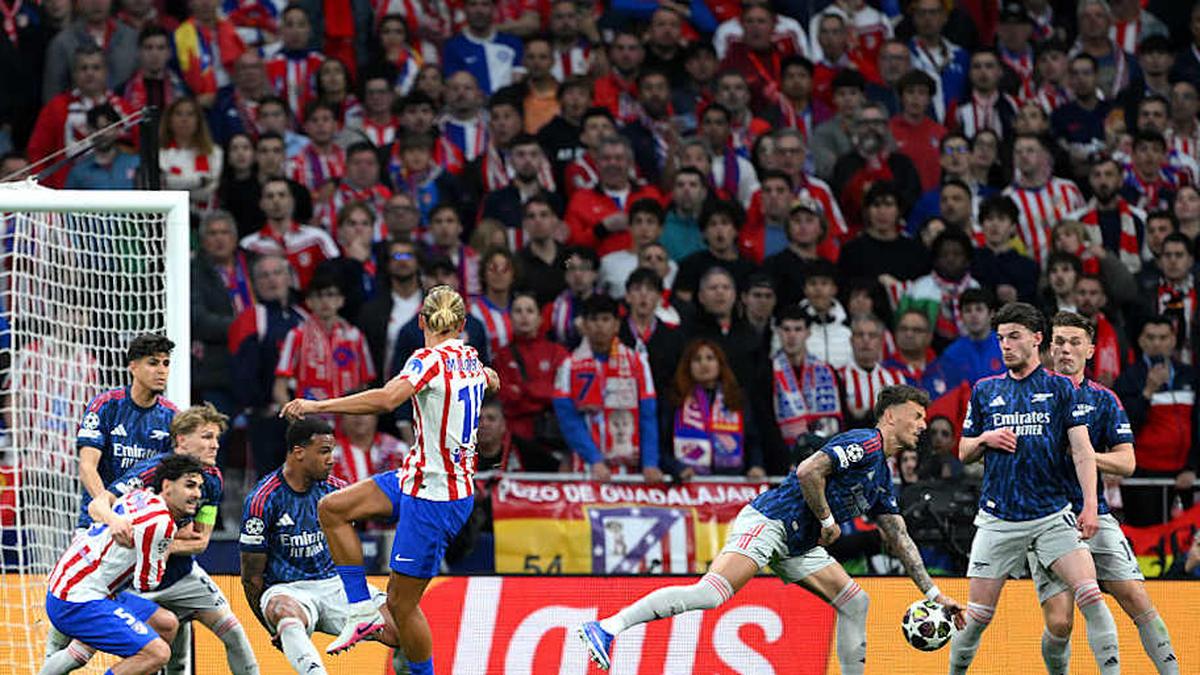  Ben White (middle right) gifted Atlético Madrid a clumsy penalty. | David Ramos/UEFA/Getty Images 