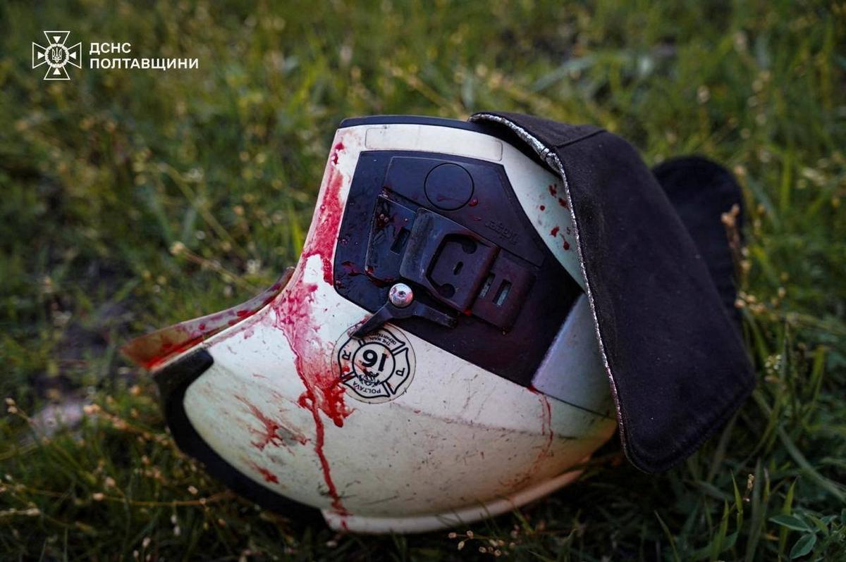 The bloodstained helmet of a rescuer lies on the ground after a missile strike killed and injured firefighters, according to the State Emergency Service of Ukraine, while they worked at a natural gas production facility that was hit by Russian drones and missiles earlier in the night, amid Russia's attack on Ukraine, in Poltava region, Ukraine May 5, 2026. Press service of the State Emergency Service of Ukraine in Poltava region/Handout via REUTERS
