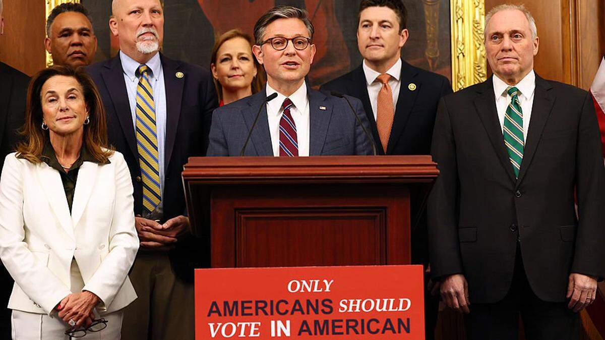 Surrounded by Republican House members, House Speaker Mike Johnson (R-La.), center, speaks during a news conference about the passage of the SAVE America Act, an election bill passed by the chamber on Wednesday that would require proof of citizenship to register to vote and require photo identification at the ballot box.