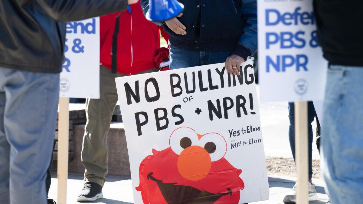 NPR suit. People participate in a rally to call on Congress to protect funding for US public broadcasters, Public Broadcasting Service (PBS) and National Public Radio (NPR), outside the NPR headquarters in Washington, DC, on March 26, 2025.