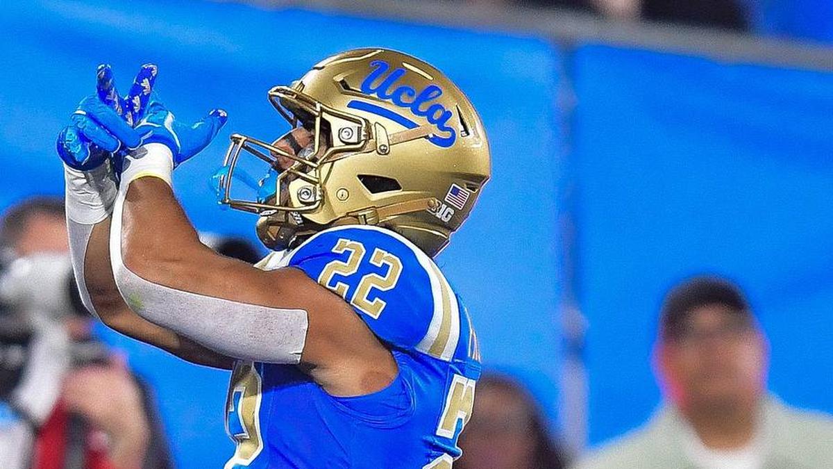  Nov 8, 2025; Pasadena, California, USA; UCLA Bruins running back Anthony Frias II (22) celebrates his touchdown scored against the Nebraska Cornhuskers during the second half at the Rose Bowl. Mandatory Credit: Gary A. Vasquez-Imagn Images | Gary A. Vasquez-Imagn Images 