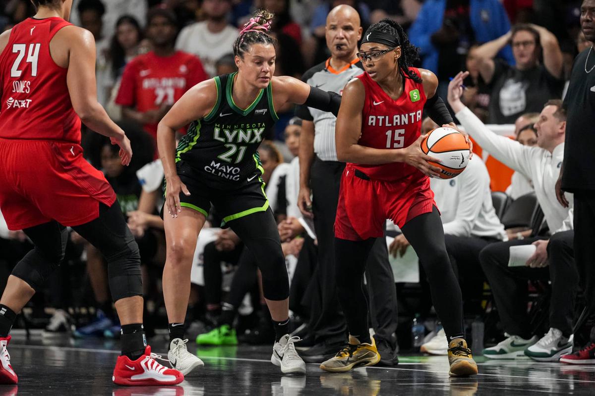  Atlanta Dream guard Allisha Gray controls the ball against Minnesota Lynx guard Kayla McBride. © Dale Zanine-Imagn Images