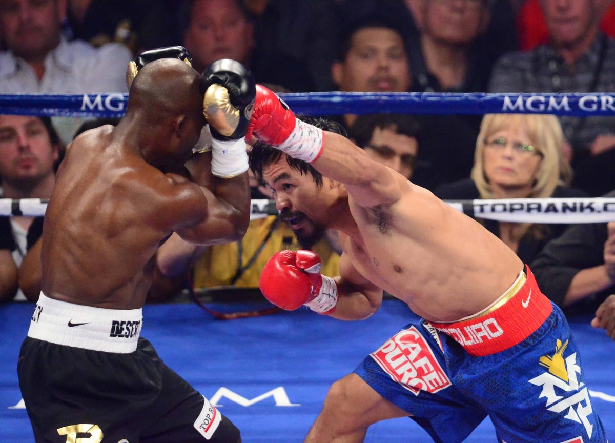  Manny Pacquiao (R) against Timothy Bradley Jr. (L) during a welterweight championship bout at the MGM Grand Garden Arena. Mark J. Rebilas-USA TODAY Sports