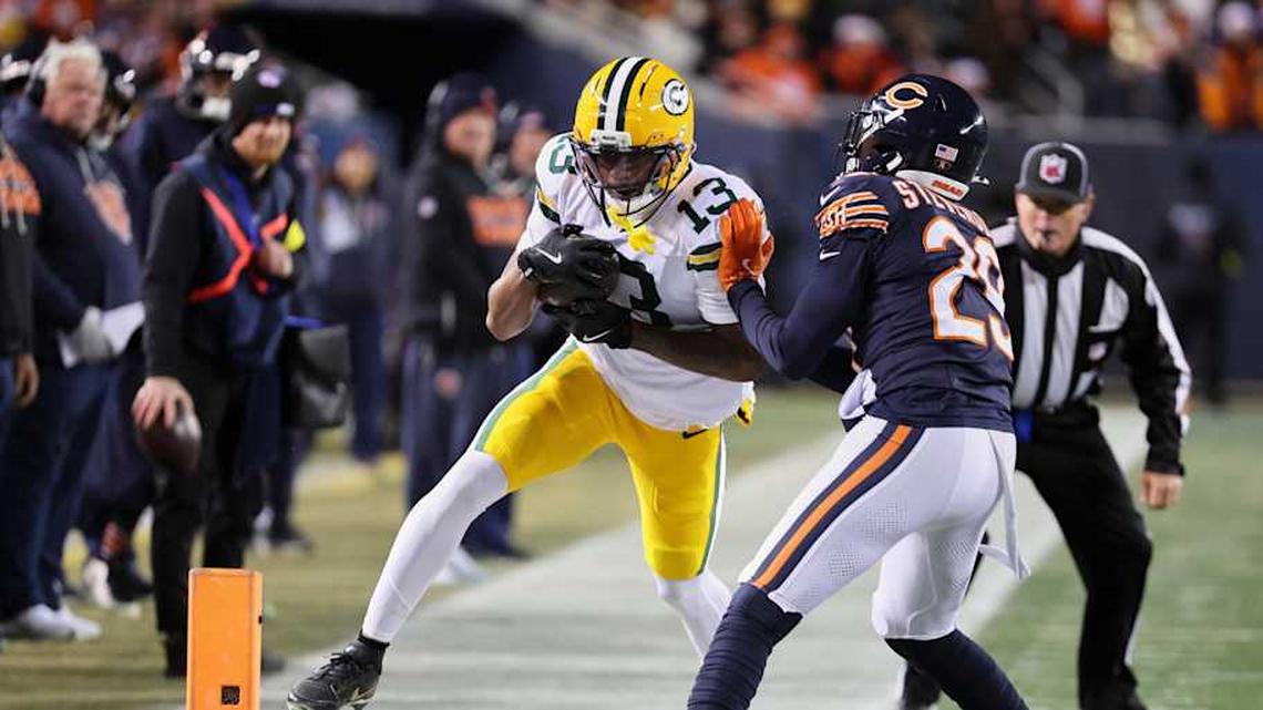  Dec 20, 2025; Chicago, Illinois, USA; Green Bay Packers wide receiver Dontayvion Wicks (13) runs out of bounds after catching a pass against Chicago Bears cornerback Tyrique Stevenson (29) during the second quarter at Soldier Field. Mandatory Credit: Mike Dinovo-Imagn Images | Mike Dinovo-Imagn Images 