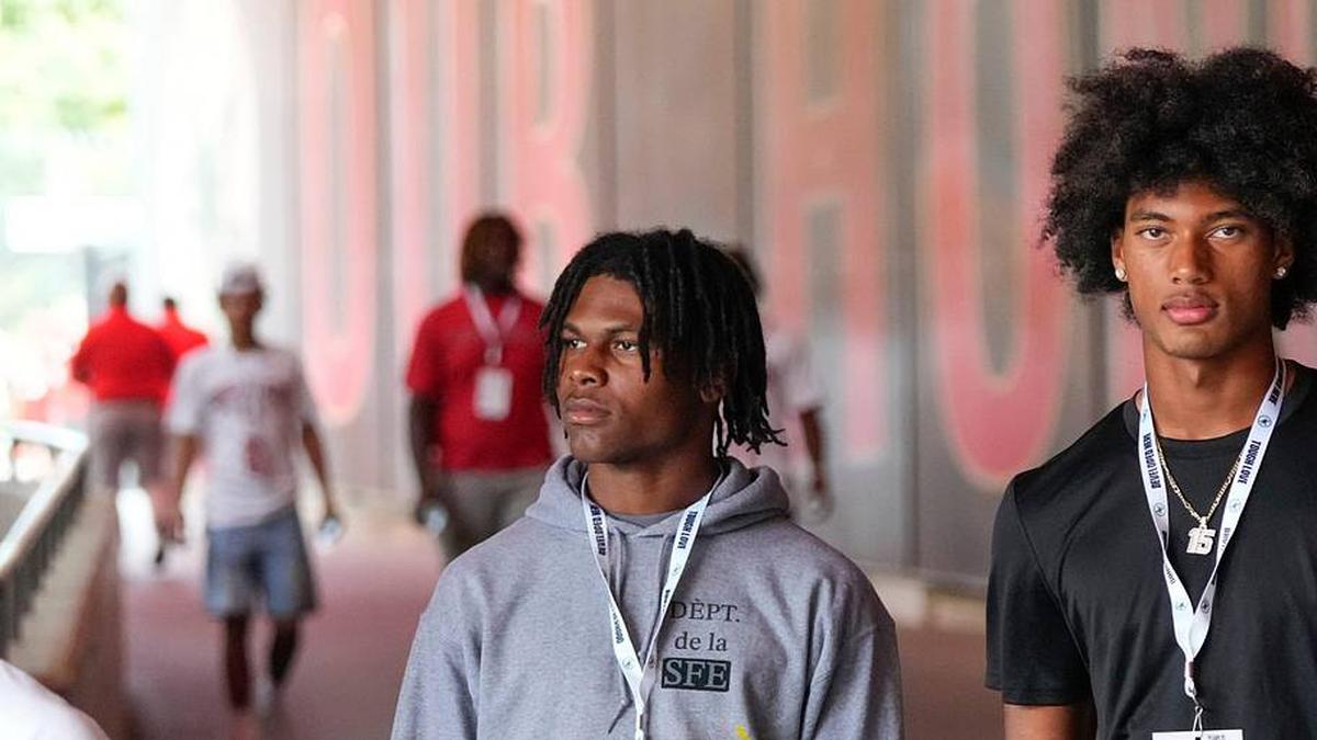  Aug 31, 2024; Columbus, OH, USA; Ohio State Buckeyes recruits Kayden Dixon-Wyatt and Chris Henry Jr. walk onto the field prior to the NCAA football game against the Akron Zips at Ohio Stadium. Ohio State won 52-6. | Adam Cairns/Columbus Dispatch / USA TODAY NETWORK via Imagn Images 
