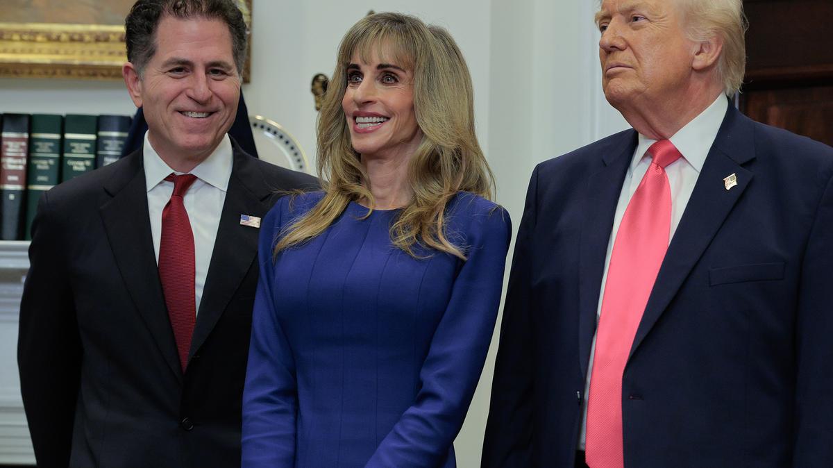 Tech billionaires Michael Dell (left) and Susan Dell join U.S. President Donald Trump to make an announcement about "Trump accounts" in the Roosevelt Room at the White House on Dec. 2, 2025, in Washington, D.C. The Dells donated $6.25 billion last year to seed so-called Trump accounts for up to 25 million children with $250 each.