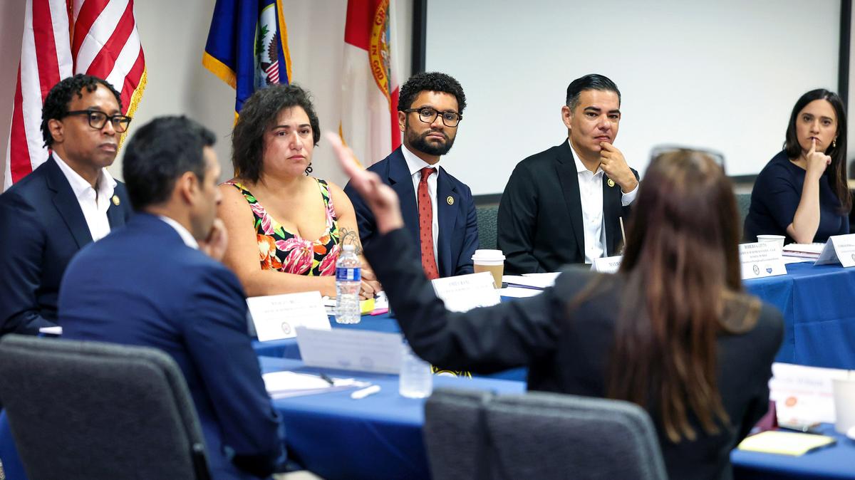 U.S. House of Representatives Committee on Oversight and Accountability members listen to Orange County commissioner Nicole Wilson, foreground, discuss the impact of recent ICE operations in Central Florida, during a meeting with community leaders at the Orange County Courthouse in Orlando, Monday, May 11, 2026. From left, Rep. Wesley Bell, D-Mo.; Rep. Suhas Subramanyam, D-Va., foreground; Rep. Emily Randall, D-Wash.,; Rep. Maxwell Frost D-Fla.; Rep. Robert Garcia, D-Calif.; and Rep. Yassamin Ansari, D-Ariz. (Joe Burbank/Orlando Sentinel/TNS)