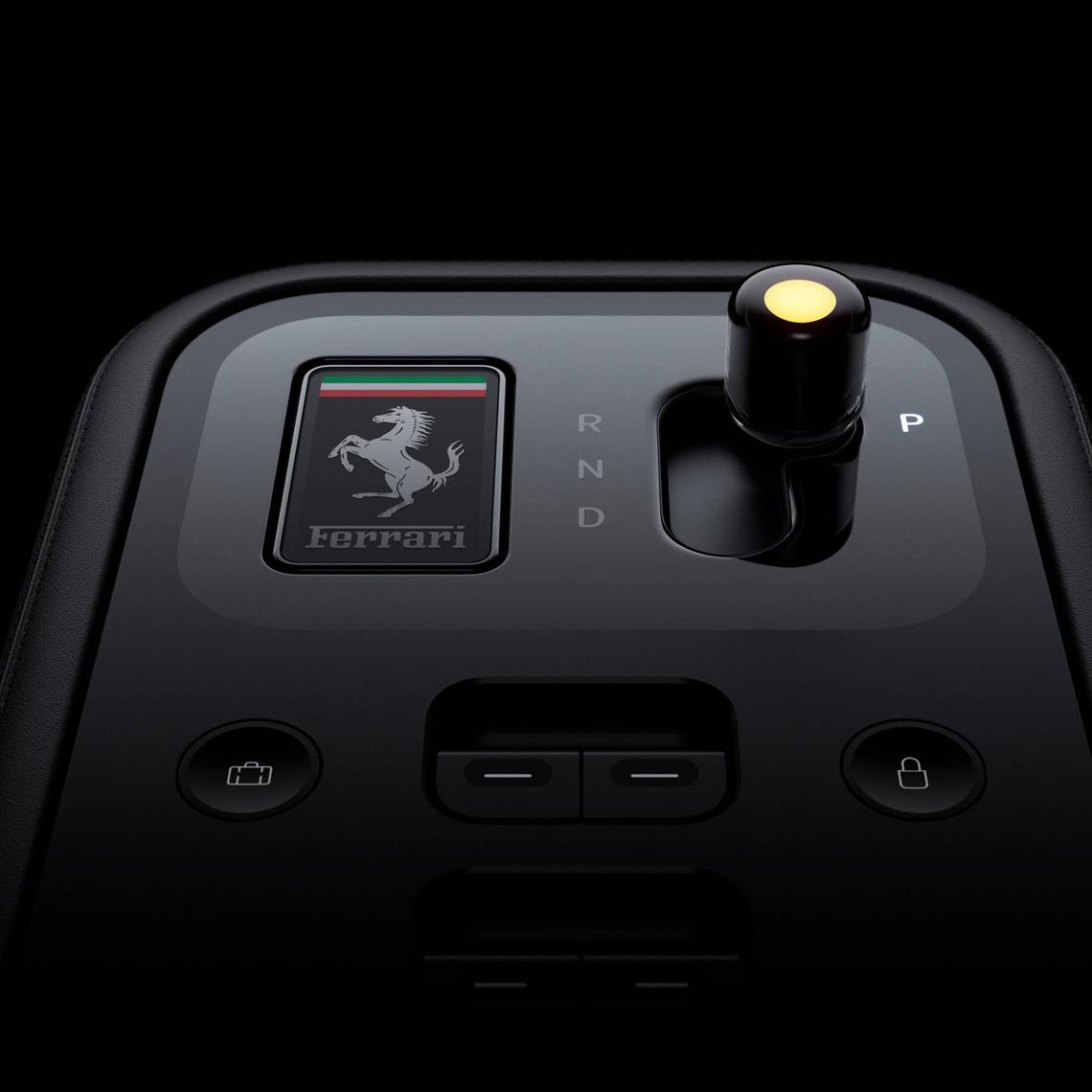  The key of the Ferrari Luce creates a "handshake" between the driver and the car by sinking into the center console and changing colors. 