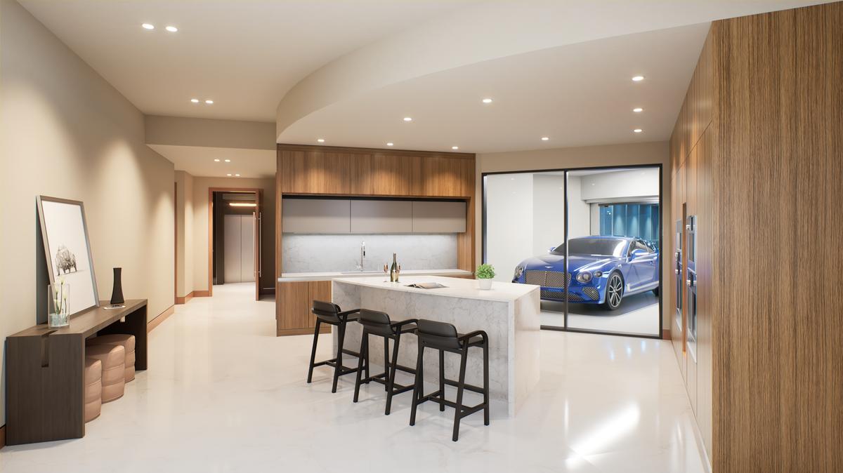  A view of a kitchen area and the car garage. 