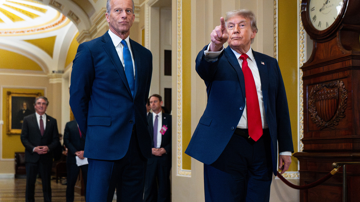 Senate Majority Leader John Thune (R-SD), left, listens as President Donald Trump speaks to the media as he arrives for the Senate Republicans' lunch meeting in the U.S. Capitol on June 24, 2026, in Washington, D.C. (Bill Clark/CQ Roll Call/Zuma Press/TNS)