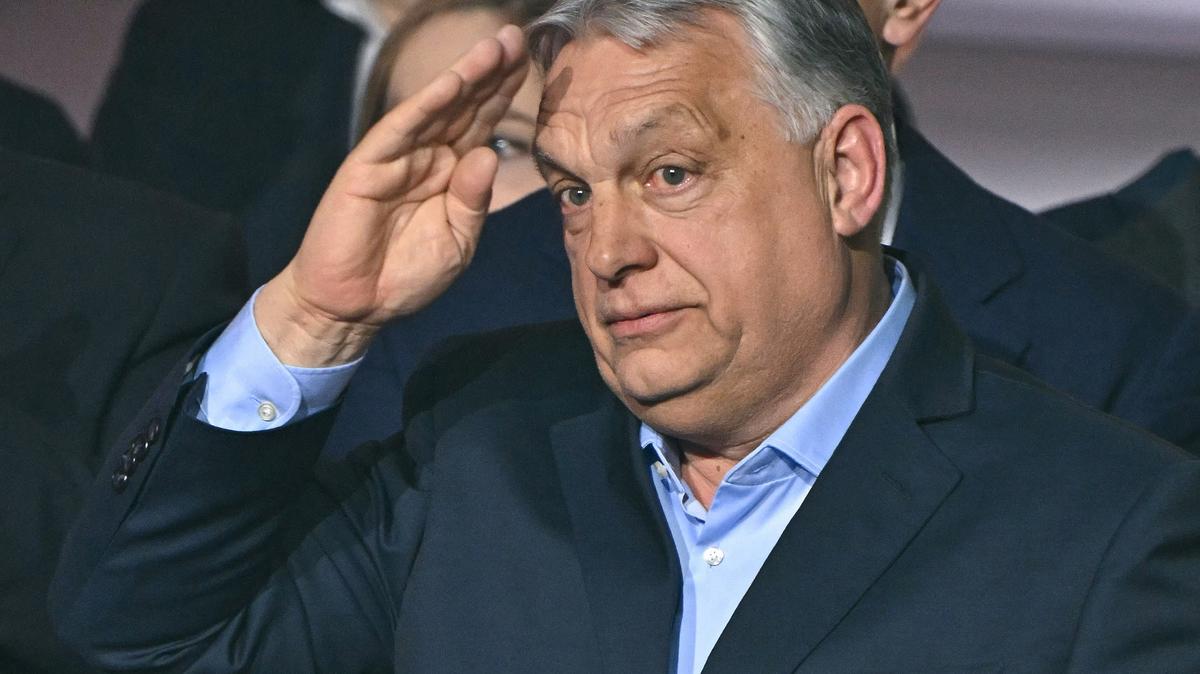 Hungary's Prime Minister Viktor Orban salutes supporters at the Balna center in Budapest during a general election in Hungary, on April 12, 2026. (Attila Kisbenedek/AFP/Getty Images/TNS)