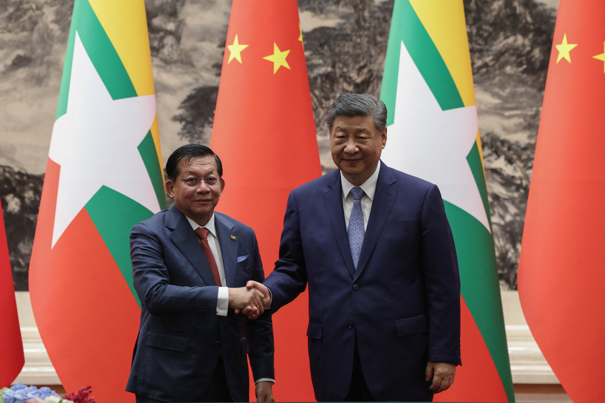 BEIJING, CHINA - JUNE 16: Chinese President Xi Jinping (R) shakes hands with Myanmar's President Min Aung Hlaing during the signing ceremony at the Great Hall of the People on June 16, 2026 in Beijing, China.  Lintao Zhang/Pool via REUTERS