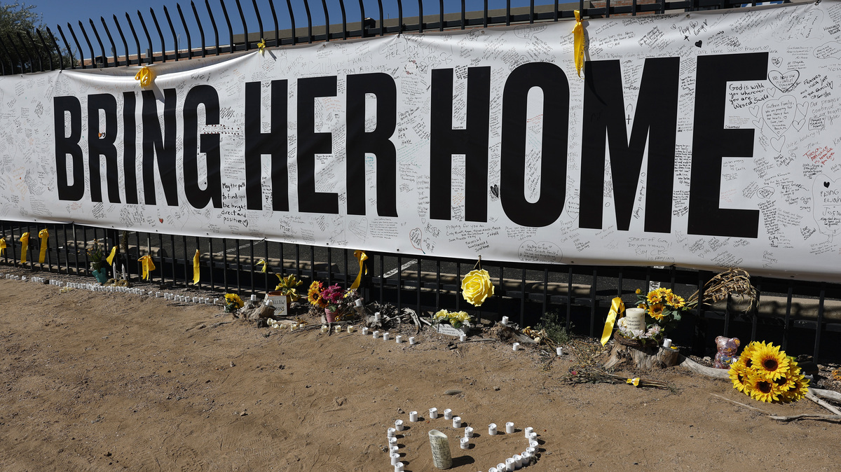 Search For Nancy Guthrie After Suspected Kidnapping Continues In Arizona. Candles and flowers are placed at a Nancy Guthrie memorial in front of the KVOA news station on March 03, 2026 in Tucson, Arizona. 