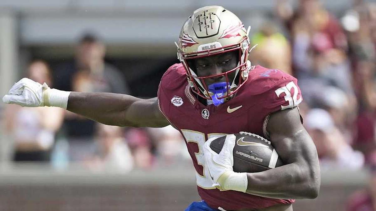  Oct 11, 2025; Tallahassee, Florida, USA; Florida State Seminoles running back Ousmane Kromah (32) is tackled by Pittsburgh Panthers linebacker Braylan Lovelace (0) during the second half at Doak S. Campbell Stadium. Mandatory Credit: Melina Myers-Imagn Images | Melina Myers-Imagn Images 