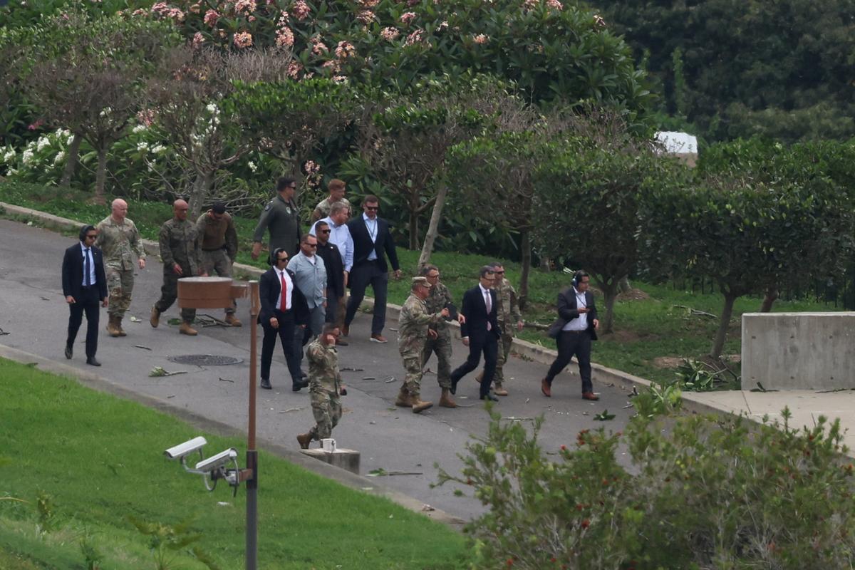 U.S. Southern Command General Francis Donovan and U.S. Charge d'Affaires to Venezuela John M. Barrett walk within the U.S. embassy compound during a military exercise, before U.S. Marine Corps MV-22B Osprey aircraft take off, in Caracas, Venezuela, May 23, 2026. REUTERS/Leonardo Fernandez Viloria