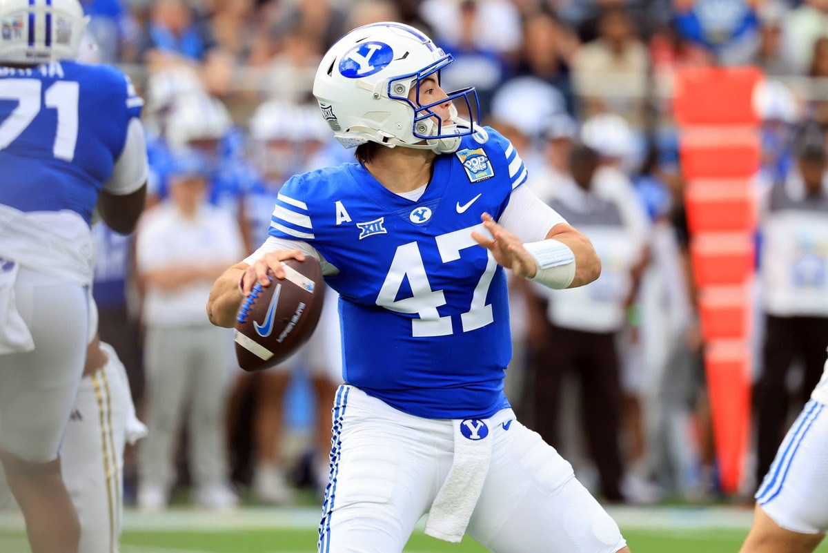  Dec 27, 2025; Orlando, FL, USA; BYU Cougars quarterback Bear Bachmeier (47) throws the ball against the Georgia Tech Yellow Jackets during the first quarter at Camping World Stadium. Mandatory Credit: Kim Klement Neitzel-Imagn Images
