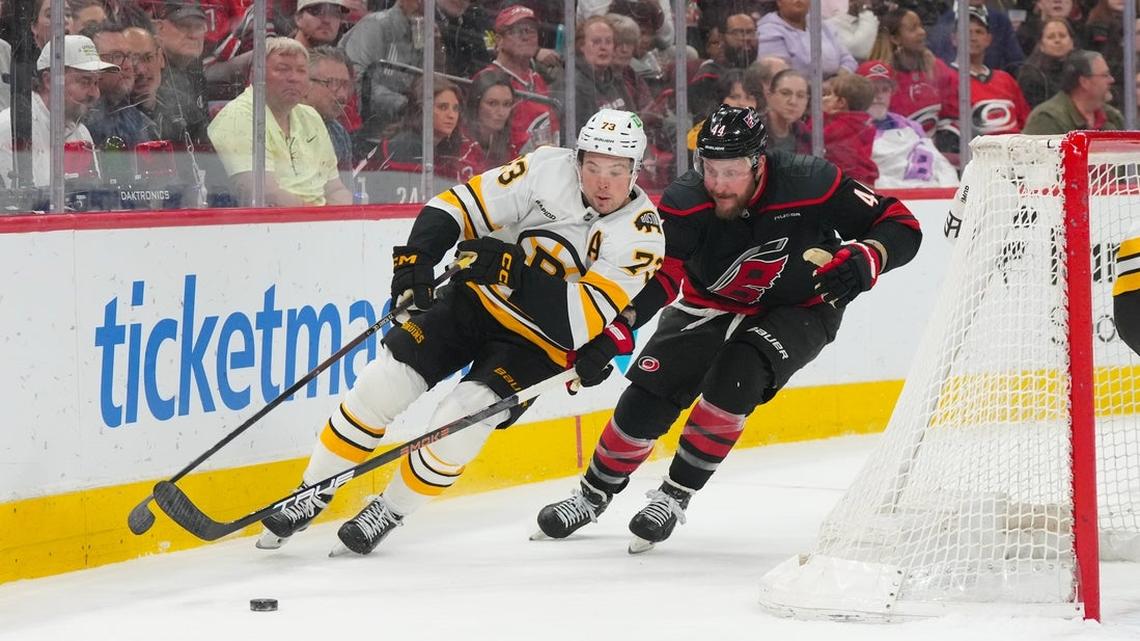 Hurricanes edge Bruins in OT to clinch division title 