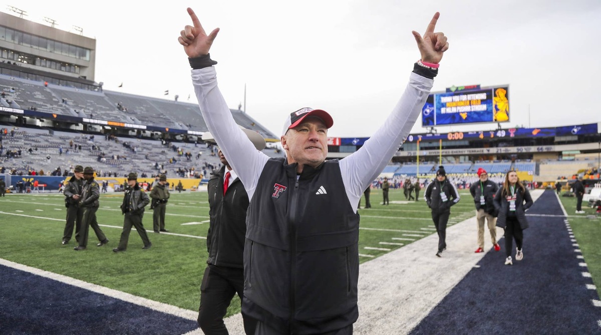  Nov 29, 2025; Morgantown, West Virginia, USA; Texas Tech Red Raiders head coach Joey McGuire celebrates with fans after defeating the West Virginia Mountaineers at Milan Puskar Stadium. Mandatory Credit: Ben Queen-Imagn Images © Ben Queen-Imagn Images