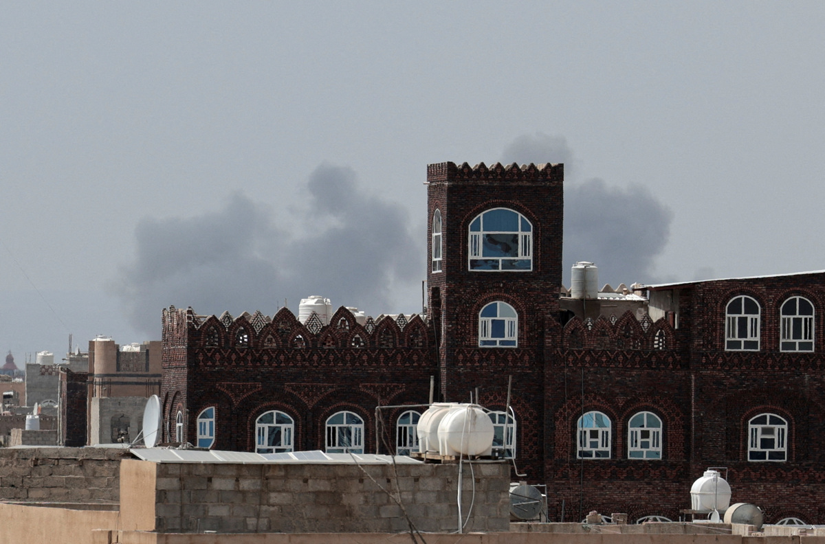 Smoke rises after an airstrike hit the Sanaa International Airport, as seen from Sanaa, Yemen, July 13, 2026. REUTERS/Khaled Abdullah