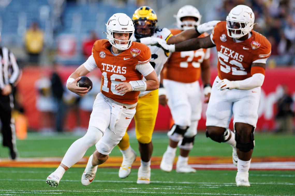  Dec 31, 2025; Orlando, FL, USA; Texas Longhorns quarterback Arch Manning (16) runs with the ball against the Michigan Wolverines during the first half at Camping World Stadium. Mandatory Credit: Matt Pendleton-Imagn Images 