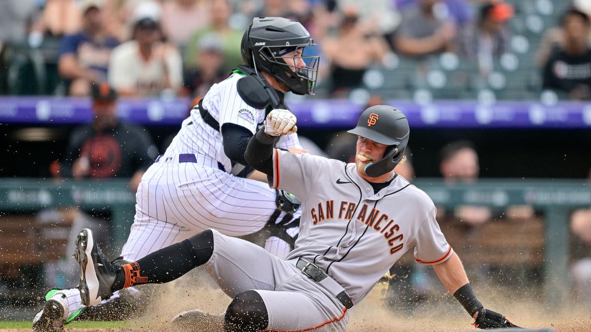 Jonah Cox (53) of the San Francisco Giants slides and scores a run in a pinch runner appearance in his MLB debut in the eighth inning against the Colorado Rockies at Coors Field on Sunday, May 31, 2026, in Denver. (Dustin Bradford/Getty Images/TNS)