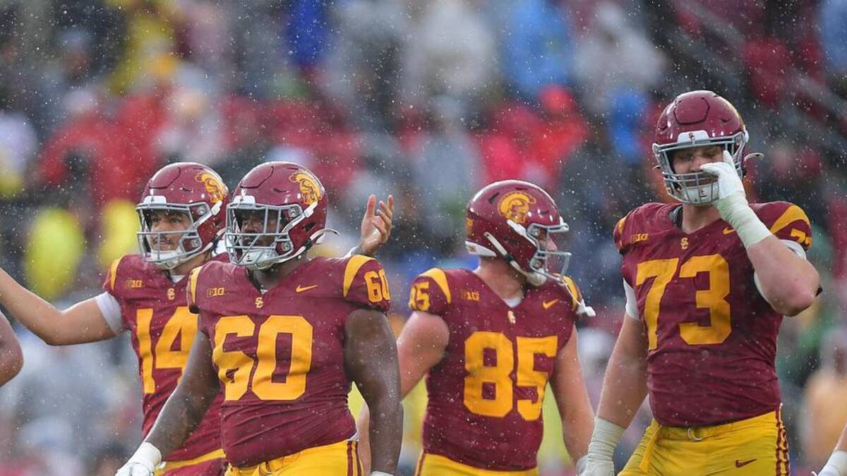  Nov 15, 2025; Los Angeles, California, USA; Southern California Trojans quarterback Jayden Maiava (14) celebrates the victory against the Iowa Hawkeyes at the Los Angeles Memorial Coliseum. Mandatory Credit: Gary A. Vasquez-Imagn Images | Gary A. Vasquez-Imagn Images 