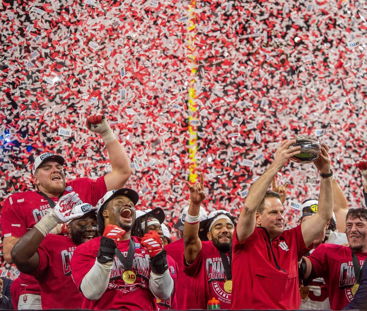  Indiana Head Coach Curt Cignetti and the Hoosies celebrate after the Indiana versus Ohio State BIg Ten Championship football game at Lucas Oil Stadium on Saturday, Dec. 6, 2025. 