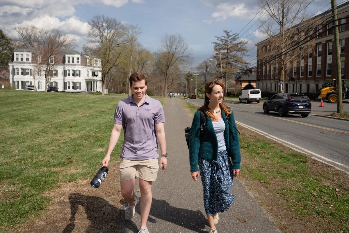  Students Ryan Peipher and Kara Lewis, upperclassmen who both come from rural areas, walk on the Amherst College campus. "Once you do get away, you experience how special it was to grow up in that small town, and also the impact you can have," says Peipher. Credit: Lucy Lu for The Hechinger Report
