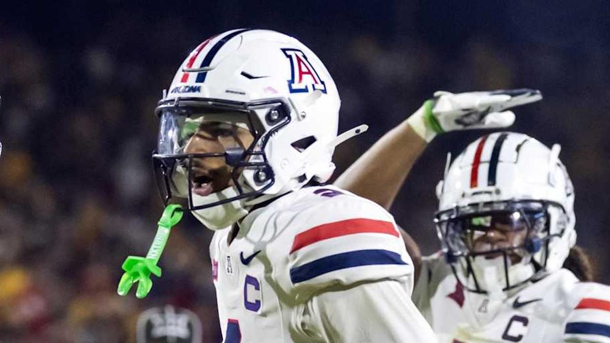  Nov 28, 2025; Tempe, Arizona, USA; Arizona Wildcats defensive back Treydan Stukes (2) celebrates with defensive back Ayden Garnes (9) after an interception against Arizona State Sun Devils in the second half during the 99th Territorial Cup at Mountain America Stadium. Mandatory Credit: Mark J. Rebilas-Imagn Images | Mark J. Rebilas-Imagn Images 