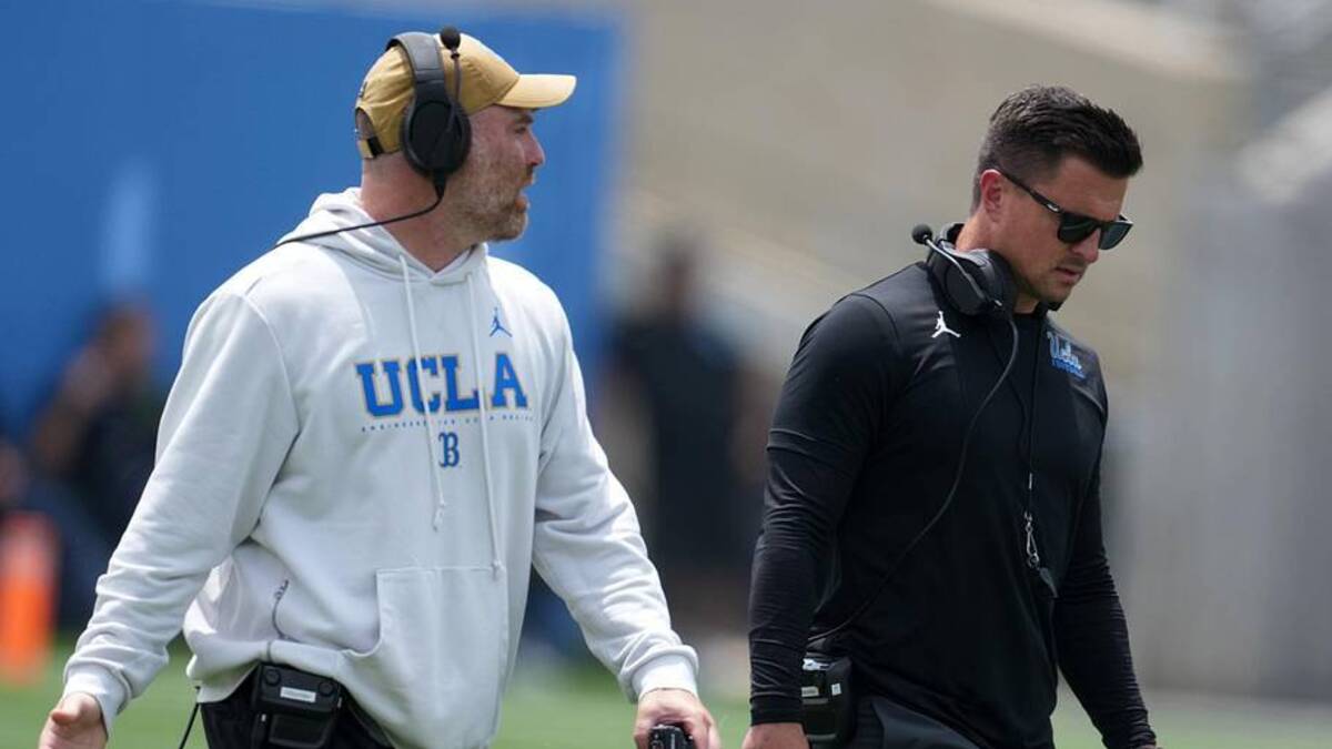  May 2, 2026; Pasadena, CA, USA; UCLA Bruins defensive coordinator Colin Hitschler (left) and head coach Bob Chesney during the spring game at Rose Bowl. Mandatory Credit: Kirby Lee-Imagn Images | Kirby Lee-Imagn Images 
