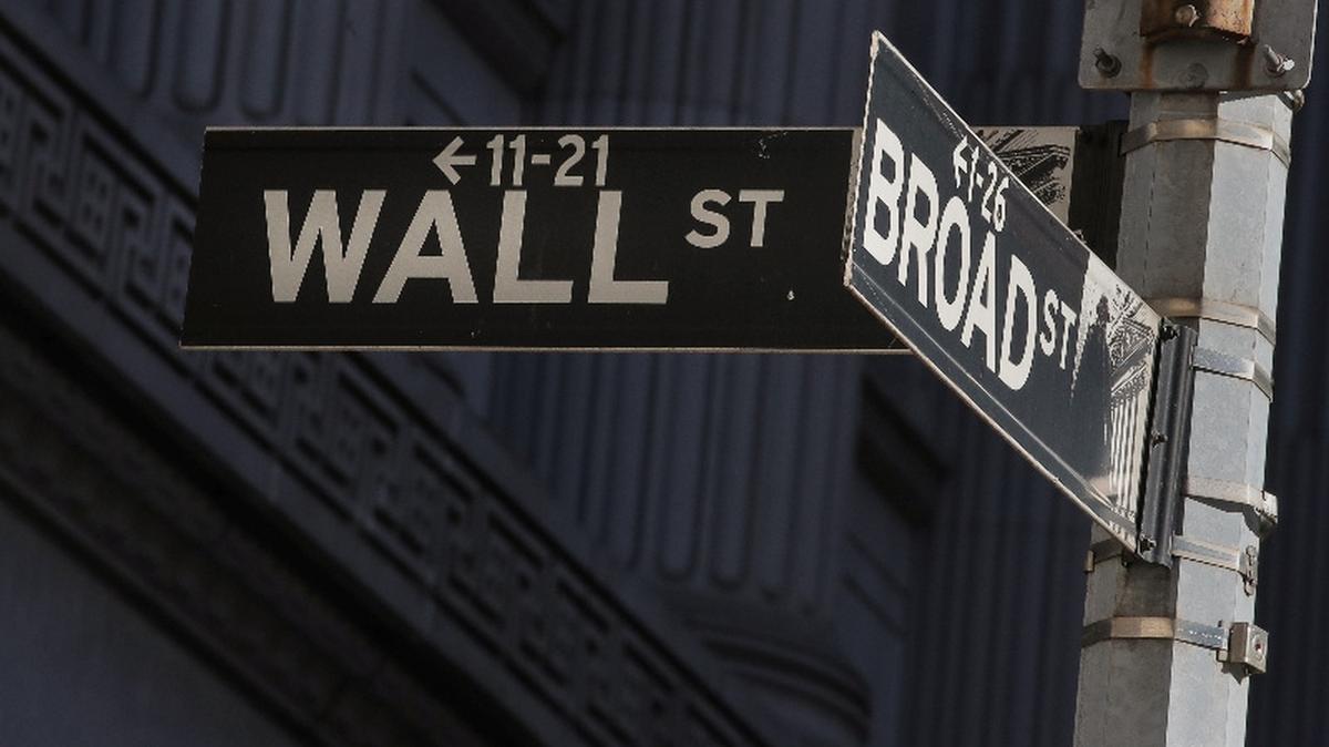 Street signs for Broad St. and Wall St. are seen outside of the New York Stock Exchange (NYSE) in New York, U.S., March 7, 2019. REUTERS/Brendan McDermid