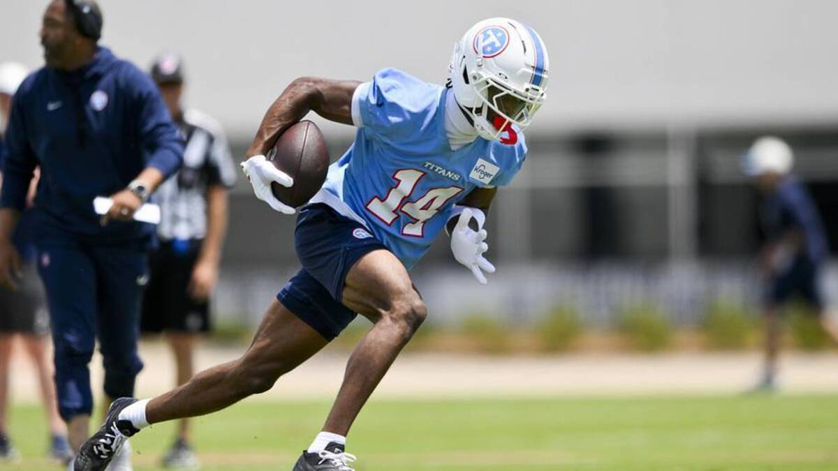  Tennessee Titans wide receiver Carnell Tate (14) runs with the ball during day 1 of mini-camp at Vanderbilt Health Football Center. | Steve Roberts-Imagn Images 