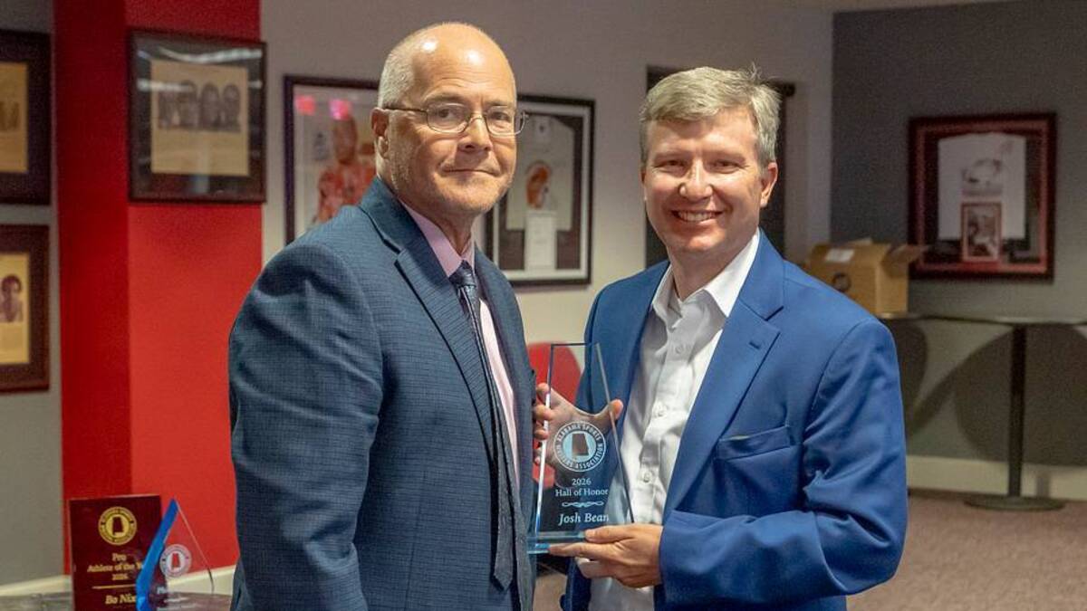  Ben Thomas presents the award with induction into the Alabama Sports Writers Association's Hall of Honor to Josh Bean at the ASWA awards banquet on June 16, 2026 at Jacksonville State. | Vasha Hunt 