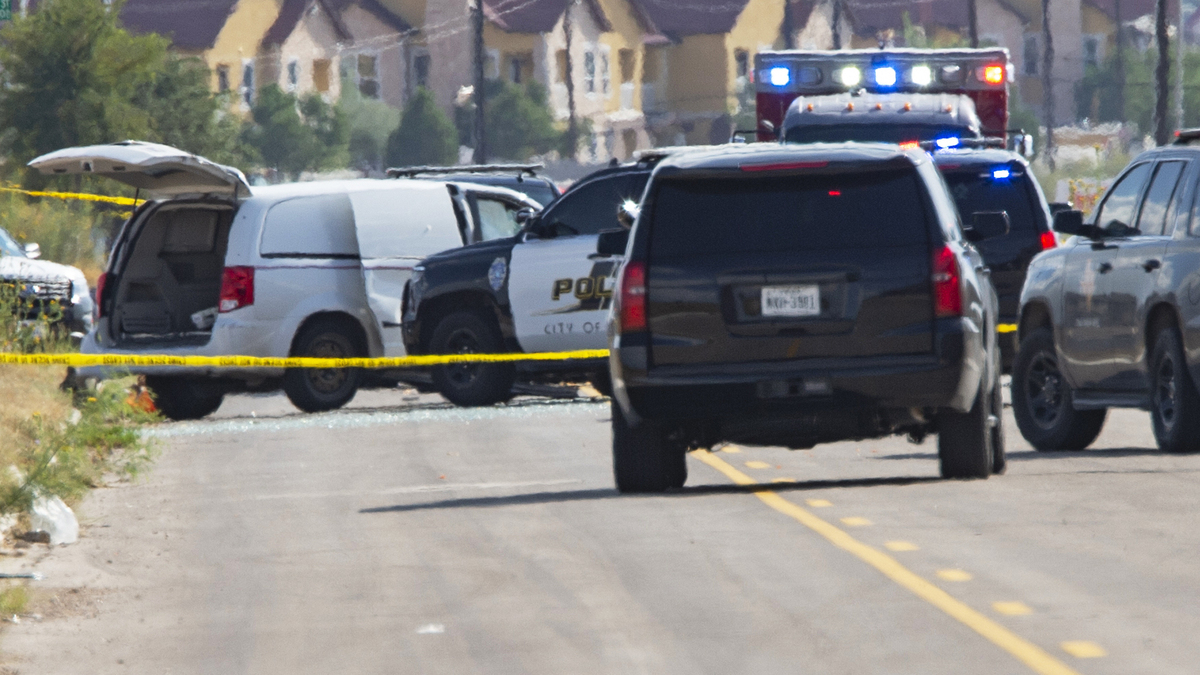 CORRECTION APTOPIX Shooting Texas. CORRECTS THE NAME OF THE SOURCE TO THE MIDLAND REPORTER-TELEGRAM - Odessa and Midland police and sheriff's deputies surround a white van in Odessa, Texas, Saturday, Aug. 31, 2019, after reports of gunfire. Police said there are "multiple gunshot victims" in West Texas after reports of gunfire on Saturday in the area of Midland and Odessa. (Tim Fischer/Midland Reporter-Telegram via AP)
