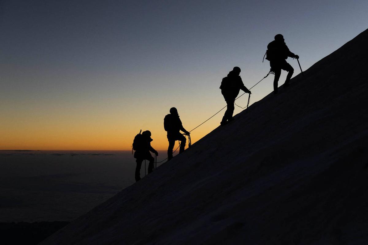  Mountain climbers. (Photo by RODRIGO OROPEZA/AFP via Getty Images) 