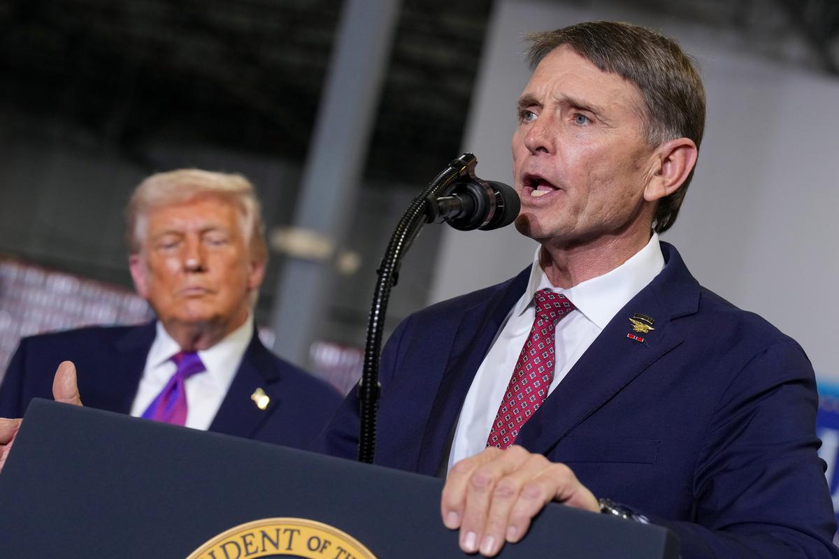  President Donald Trump and House candidate Ed Gallrein speak during an event on March 11, 2026, in Hebron, Kentucky. 