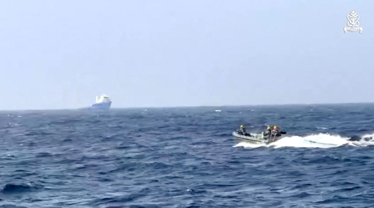 Pakistan Navy personnel in a boat move towards the Indian vessel MV Gautam after receiving a distress call from the vessel following a critical technical failure in the Arabian Sea, according to Pakistan's military, in this still image obtained from a video released on May 5, 2026. ISPR/Handout via REUTERS