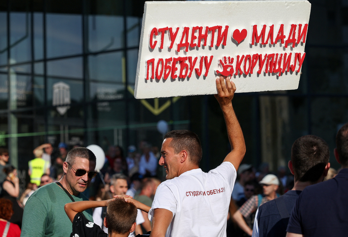 A man holds a placard during a student-led protest seeking to maintain the momentum of a nationwide anti-government movement that emerged after the deadly collapse of the Novi Sad railway station canopy in November 2024, in Novi Sad, Serbia, June 20, 2026. REUTERS Zorana Jevtic