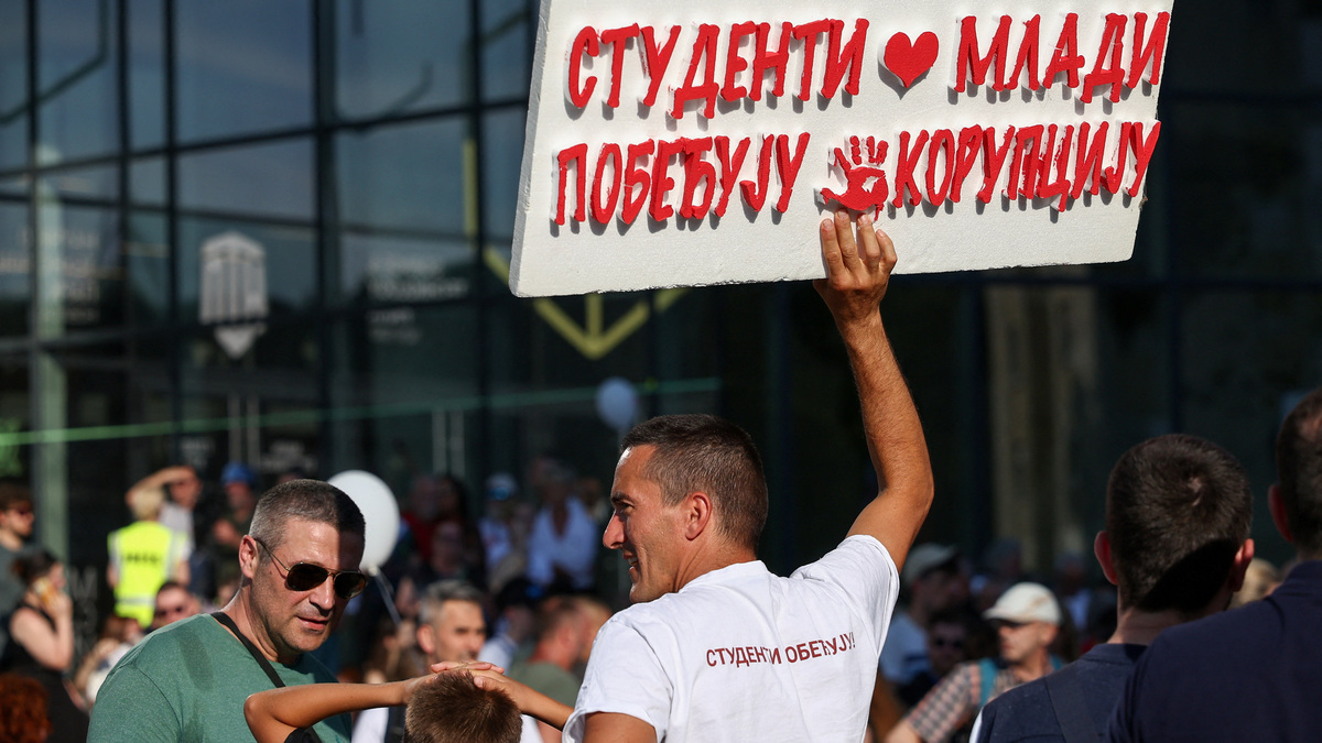 A man holds a placard during a student-led protest seeking to maintain the momentum of a nationwide anti-government movement that emerged after the deadly collapse of the Novi Sad railway station canopy in November 2024, in Novi Sad, Serbia, June 20, 2026. REUTERS Zorana Jevtic