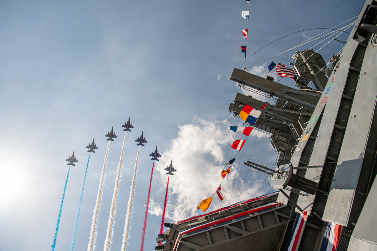 United Arab Emirates Air Force's Al Fursan (The Knights) aerobatic team flying Hongdu L-15 Falcon advanced jet trainer aircraft soar over Nimitz-class aircraft carrier USS Nimitz (CVN 68) during International Naval Review 250, July 4, 2026. International Naval Review 250 honors the Navy, Marine Corps, and Coast Guard’s enduring role on, under, and above the seas. (U.S. Navy photo by Mass Communication Specialist Seaman Frankie M. Guage)
