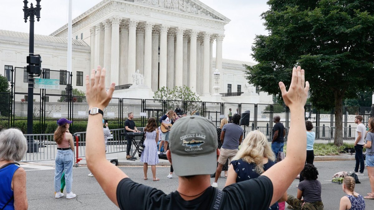 Demonstrators pray in front of the U.S. Supreme Court on June 27 2022. On June 19, 2000, the U.S. Supreme Court ruled that prayers led by students at public high school football games aren't permitted under the constitutional separation of church and state. File Photo by Jemal Countess/UPI