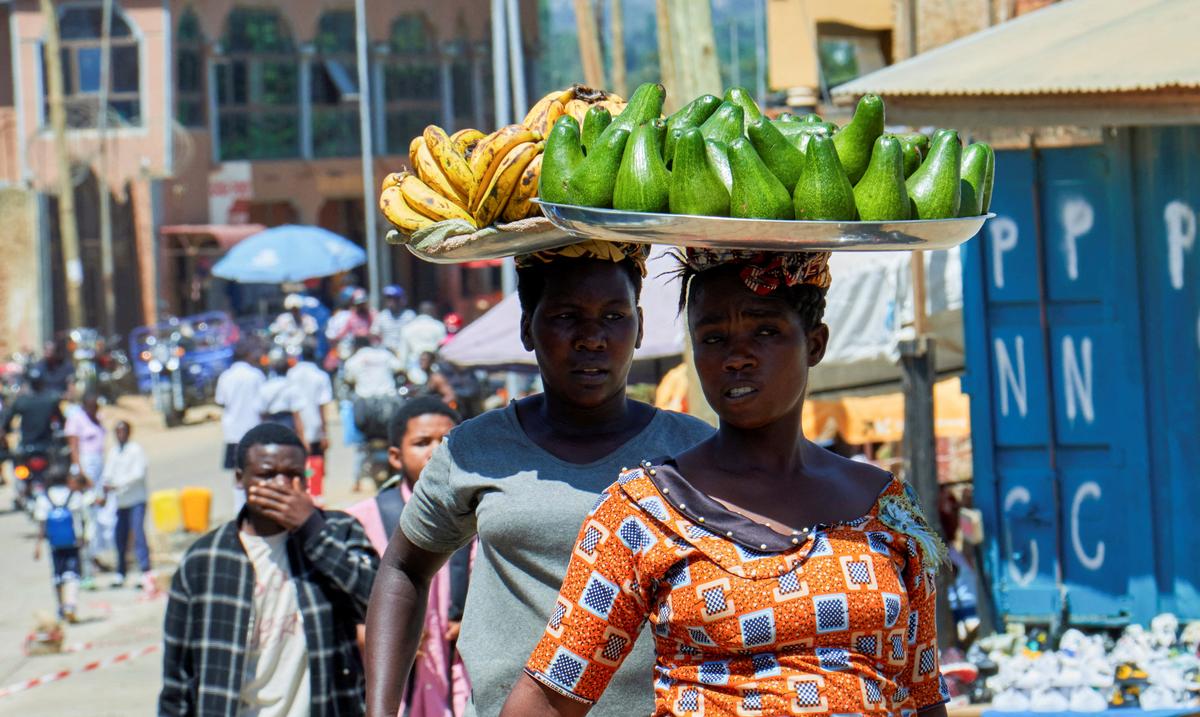 Congolese women sell fruits along a street, as aid agencies intensify efforts to contain a new Ebola outbreak involving the Bundibugyo strain, in Bunia, Ituri province, Democratic Republic of Congo, May 22, 2026. REUTERS/Gradel Muyisa Mumbere