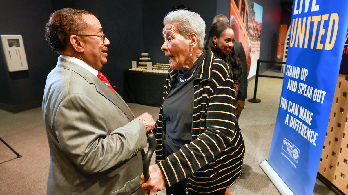 Former Orange County commissioner Mable Butler talks with retired Ninth Judicial Circuit chief judge Belvin Perry during the premiere at the Orlando Science Center of “Know Your Place,” a documentary produced by the Heart of Florida United Way that explores themes of history, racism, segregation and bias in Central Florida, Monday, Feb. 5, 2023. Butler, along with other prominent Black Central Floridians, is featured in the film. (Joe Burbank/Orlando Sentinel)