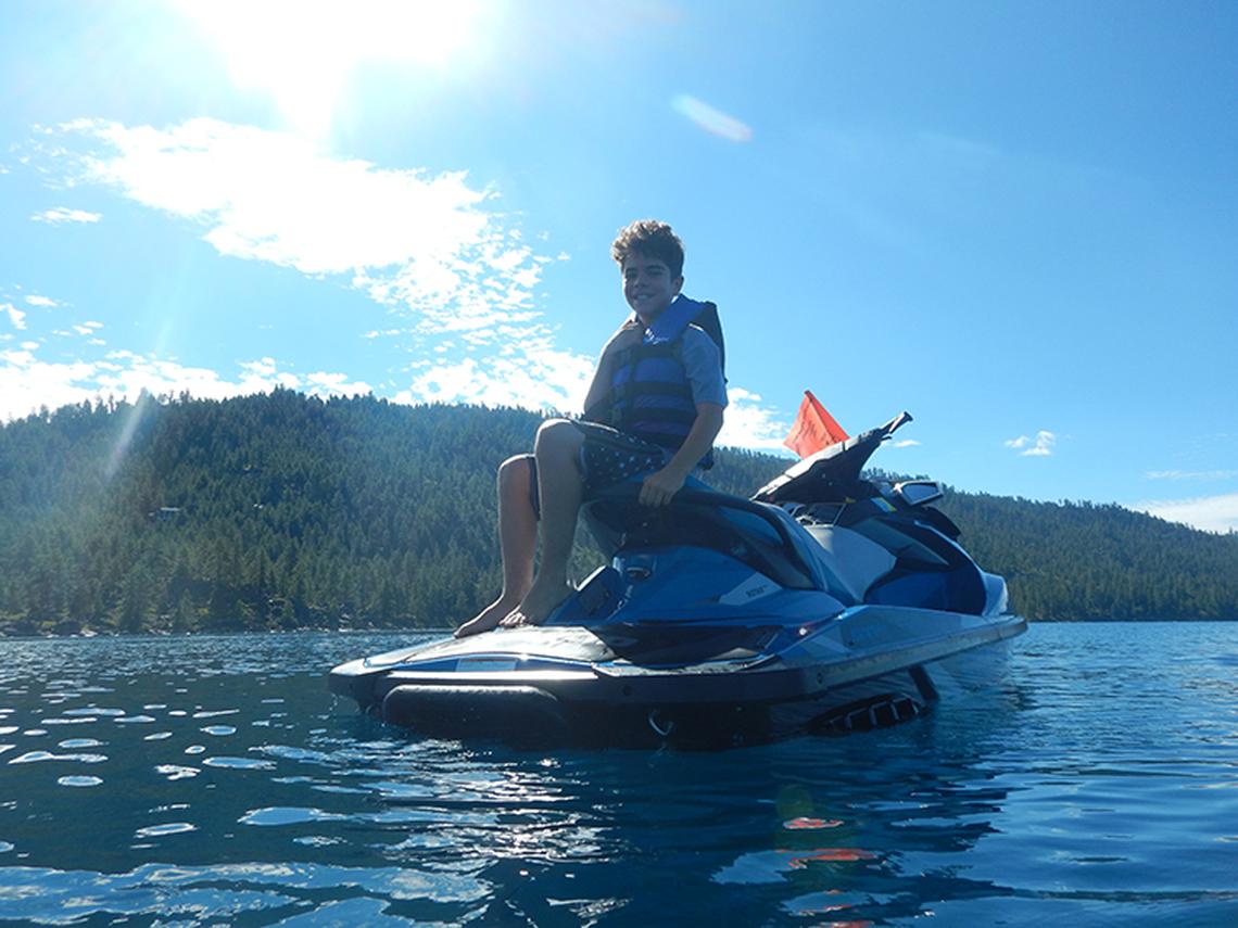  My son thinking about jumping into the water from his Zephyr Cove Marina Team jet ski. Photo credit: Margot Black 
